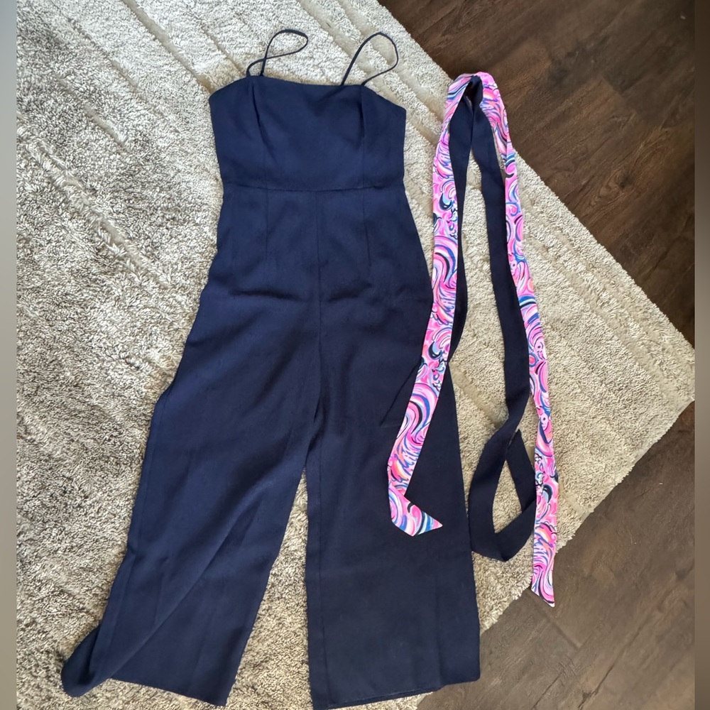 Lilly Pulitzer size 6 navy blue jumper. Two different belts to tie around waist